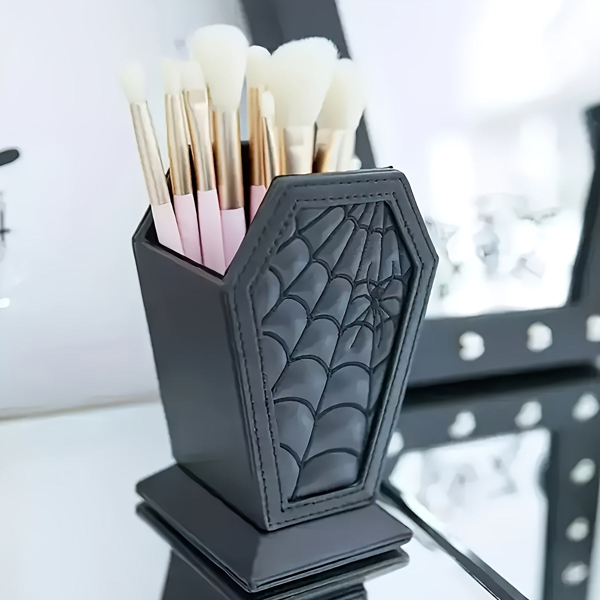Load video: Gothic CoffinShaped Spider Web Makeup Brush Holder Lightweight Plastic Desk Organizer for Vanity or Office Decor