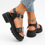 Women's Punk Style Platform Sandals - Open-Toe Cross Strap with Metallic Studs & Bat Charm Buckle, Chunky Rubber Sole, PU Cover Upper - Black Summer Party & Streetwear Footwear, Trendy Street Shoes, Metallic Embellishments, Durable Rubber Sole